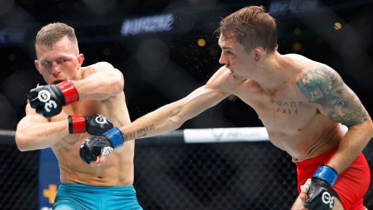 Brad Katona, left, exchanges blows with Cody Gibson during a UFC 292 mixed martial arts fight, Saturday, August 19, 2023.