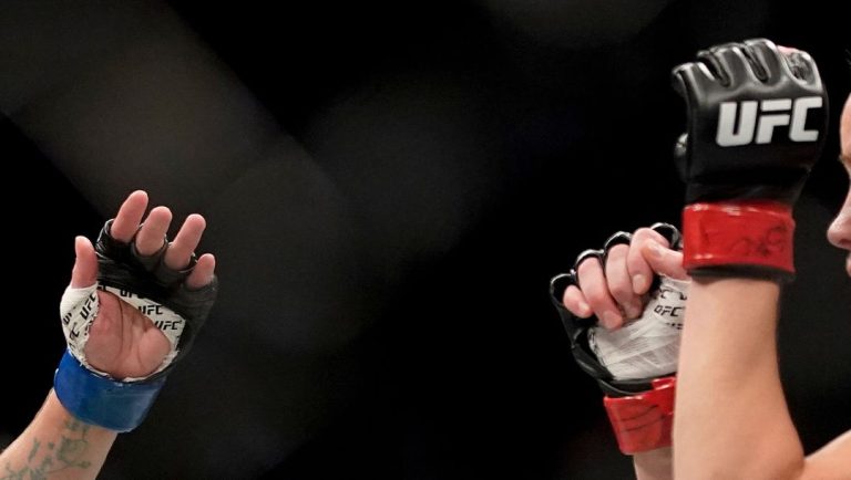 Valentina Shevchenko, right, fights Lauren Murphy during a women's flyweight mixed martial arts title bout at UFC 266.