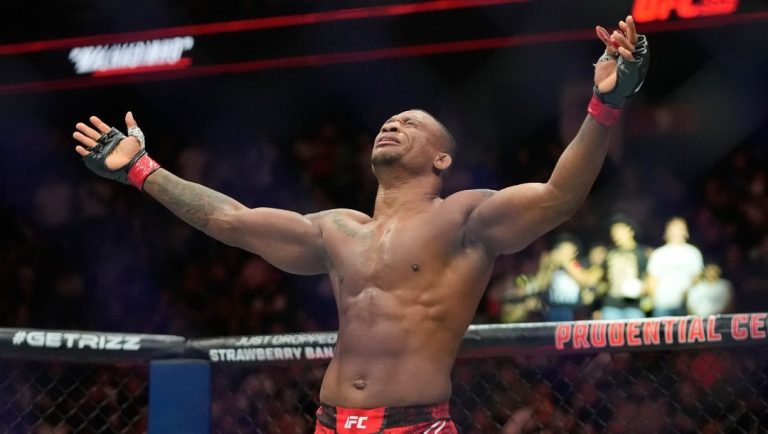 Brazil's Jailton Almeida celebrates after defeating Moldova's Alexandr Romanov in a heavyweight bout at the UFC 302.