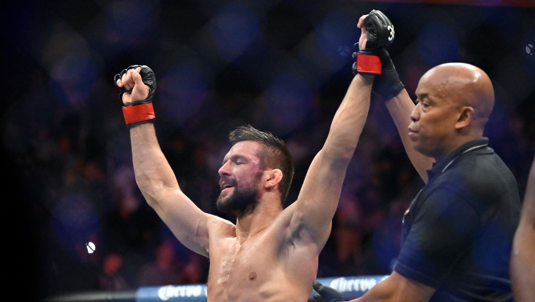 Mateusz Gamrot reacts after being declared the winner over Jalin Turner with a split decision in a UFC 285 mixed martial arts.