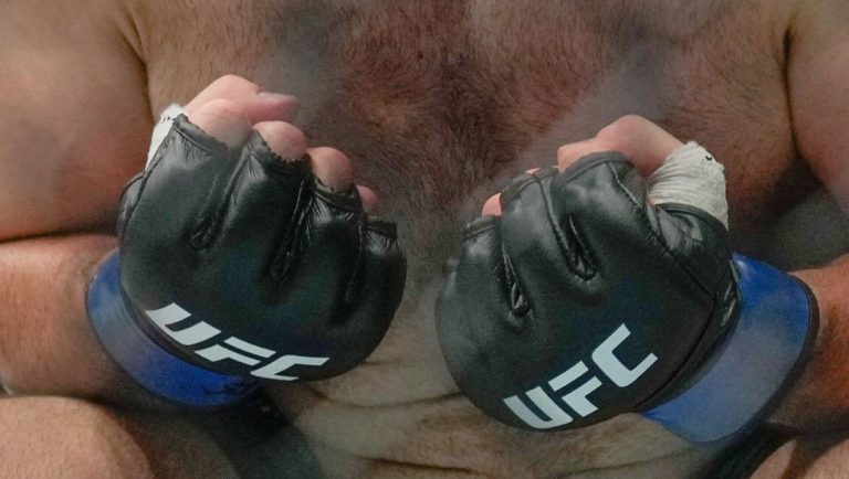 Russia's Azmat Murzakanov, reacts after defeating Serbia's Aleksandar Rakic in a light heavyweight bout.