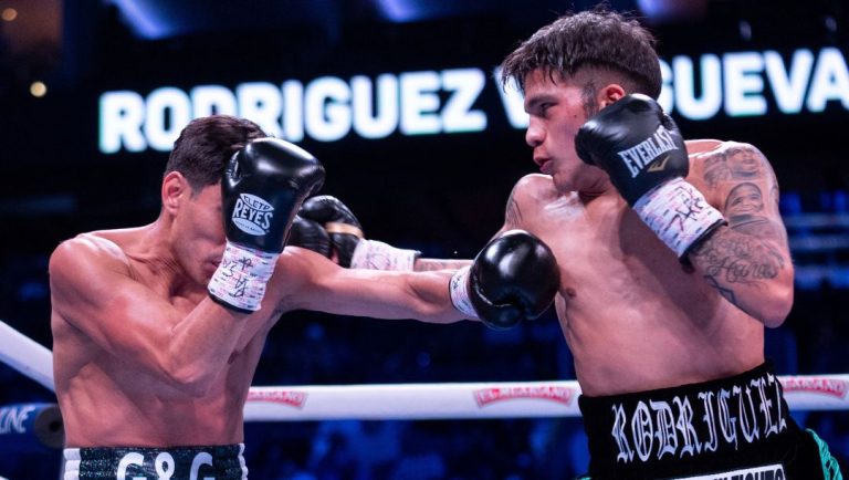 Jesse Rodriguez, right, throws a punch against Padro Guevara, left, during the first round of a WBC World and Ring Magazine.