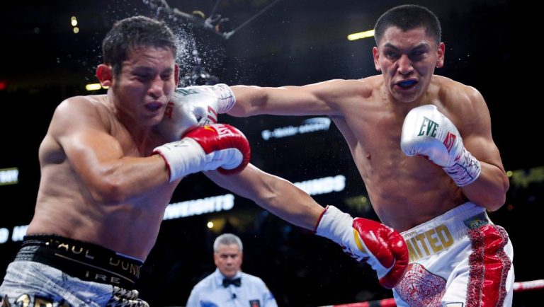 Vergil Ortiz Jr., right, hits Mauricio Herrera during a welterweight boxing match Saturday, May 4, 2019, in Las Vegas.