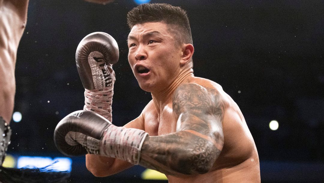 Arnold Khegai, right, fights Eduardo Baez during a featherweight boxing match on Saturday, Dec. 10, 2022, in Omaha, Neb.