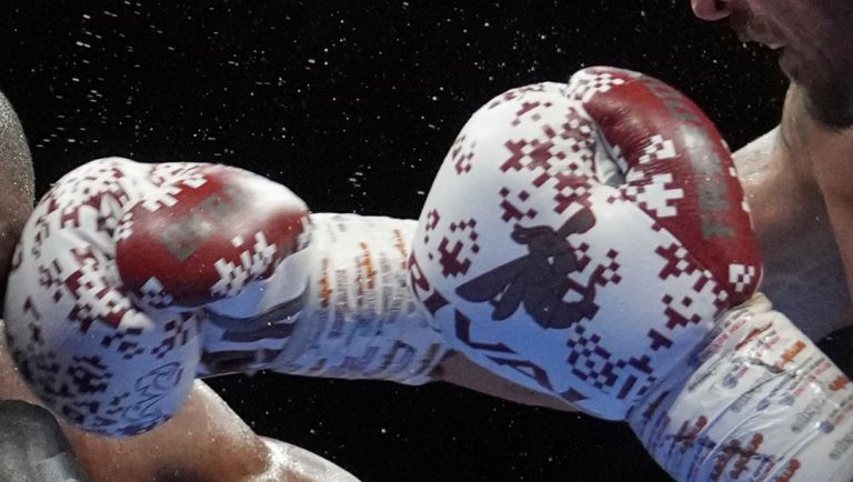 Ukraine's Oleksandr Usyk, right, and Britain's Daniel Dubois in action during the undisputed world heavyweight boxing.