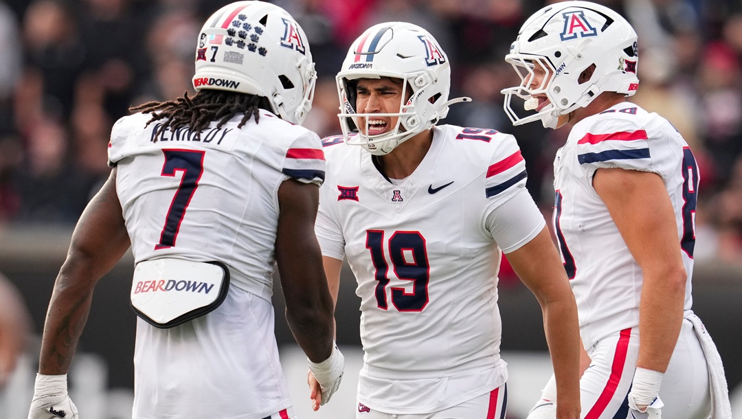 Arizona kicker Michael Salgado-Medina (19) celebrates with teammate Chase Kennedy (7) after kicking a field goal during the second half of an NCAA college football game against Cincinnati, Saturday, Nov. 15, 2025, in Cincinnati.