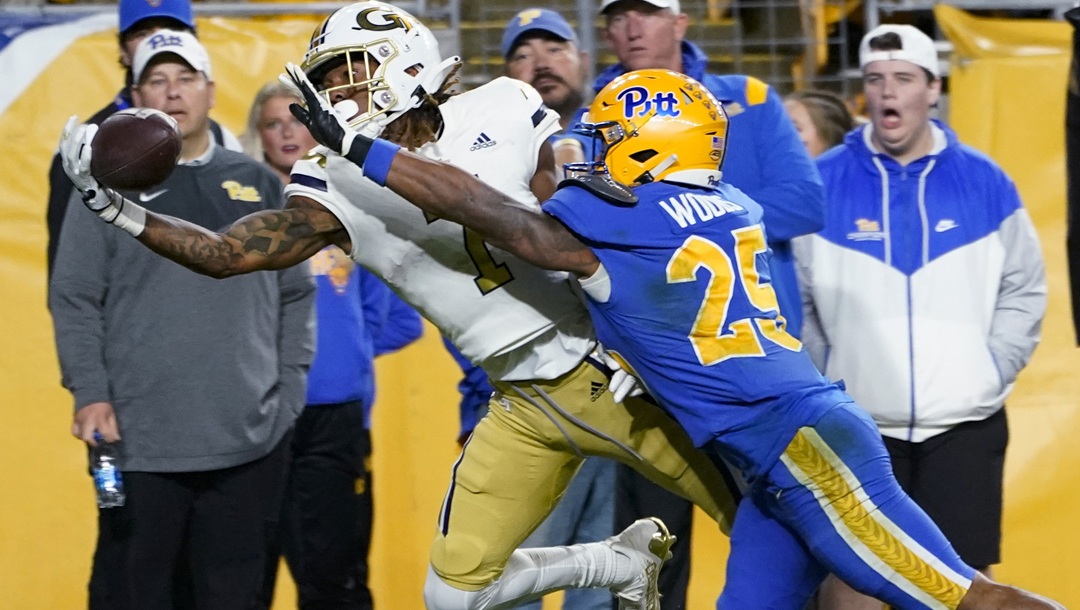 Pittsburgh defensive back A.J. Woods (25) breaks up a pass to Georgia Tech wide receiver Malachi Carter (7) during the second half of an NCAA college football game Saturday, Oct. 1, 2022, in Pittsburgh. Georgia Tech won 26-21.