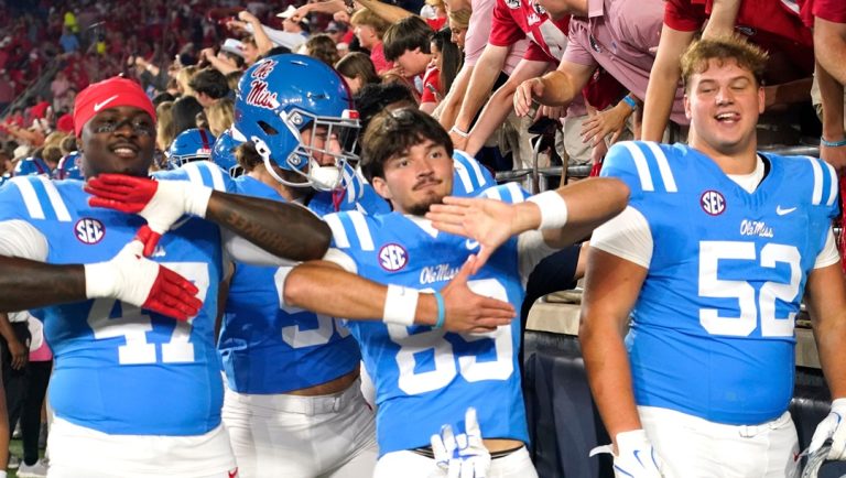 Mississippi players celebrate their win at an NCAA college football game against Florida, Saturday, Nov. 15, 2025, in Oxford, Miss.