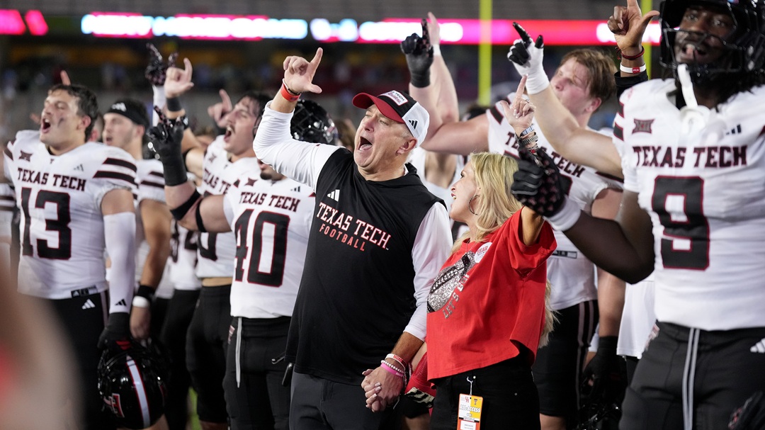 Texas Tech head coach Joey McGuire and his wife, Debbie, sing the "Guns Up" fight song as they celebrated their win against Houston after an NCAA college football game, Saturday, Oct. 4, 2025, in Houston.