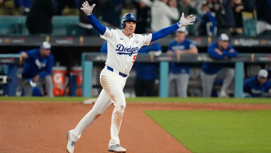 Los Angeles Dodgers' Freddie Freeman celebrates his walk off home run against the Toronto Blue Jays during the 18th inning in Game 3 of baseball's World Series, Monday, Oct. 27, 2025, in Los Angeles.