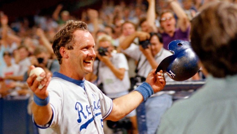 Kansas City Royals' George Brett holds the ball he hit as he heads toward the Royals dugout after hitting his 3,000th career hit against the California Angels in Anaheim, Calif., Oct. 1, 1992. "It's a relief...I am the happiest man in the world right now," said Brett, who was playing for the first time after missing tow games with a sore shoulder.