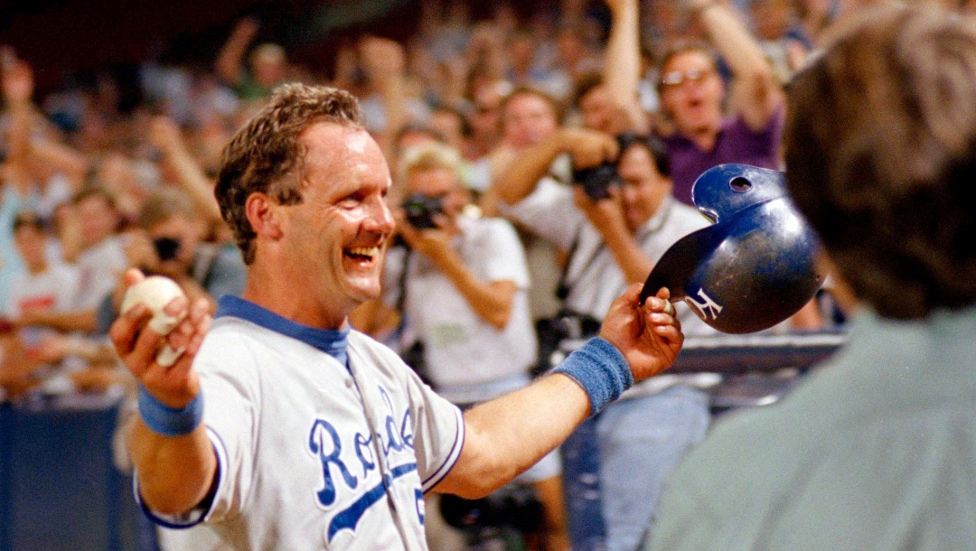 Kansas City Royals' George Brett holds the ball he hit as he heads toward the Royals dugout after hitting his 3,000th career hit against the California Angels in Anaheim, Calif., Oct. 1, 1992. "It's a relief...I am the happiest man in the world right now," said Brett, who was playing for the first time after missing tow games with a sore shoulder.