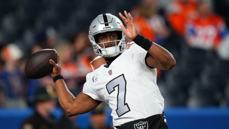 Las Vegas Raiders quarterback Geno Smith warms up before an NFL football game against the Denver Broncos Thursday, Nov. 6, 2025, in Denver.
