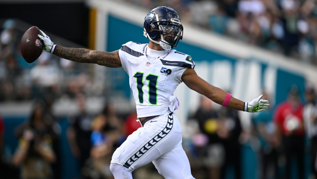 Seattle Seahawks wide receiver Jaxon Smith-Njigba catches a touchdown pass on a 61-yard pass play during the first half of an NFL football game against the Jacksonville Jaguars, Sunday, Oct. 12 2025, in Jacksonville, Fla.