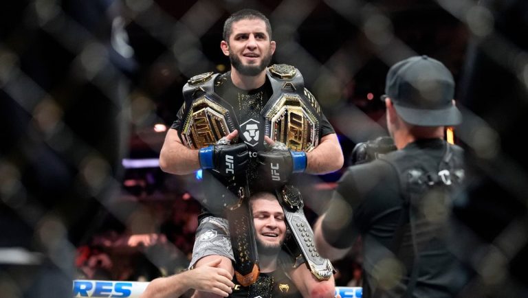 Russia's Islam Makhachev celebrates after defeating Australia's Jack Della Maddalena during a welterweight title bout.