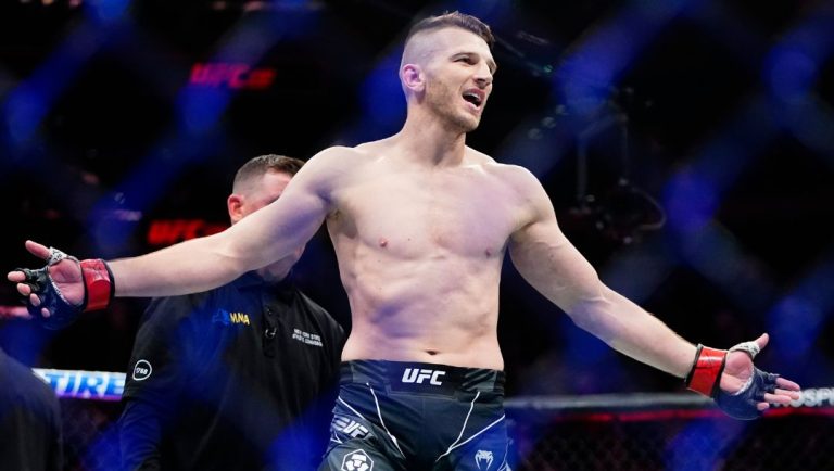 New Zealand's Dan Hooker gestures to his corner after a lightweight bout against Peru's Claudio Puelles at the UFC 281.
