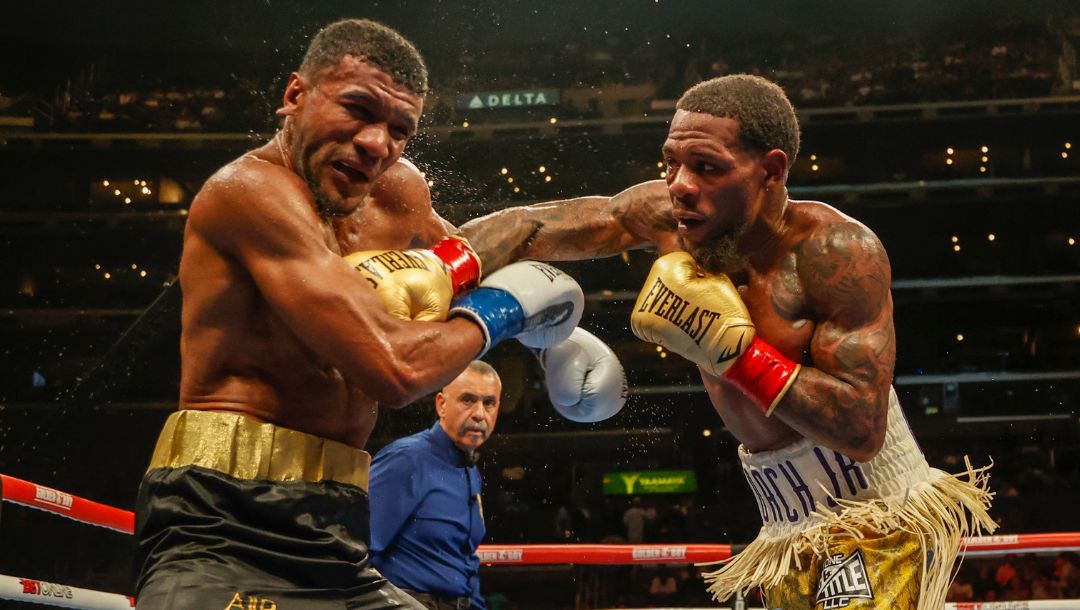 Lamont Roach Jr. , right, and Angel Rodriguez fight during a 12 Rounds WBA Super Featherweight Title Eliminator boxing match.
