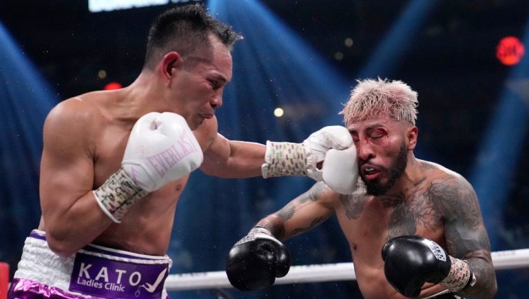 Alexandro Santiago, right, fights Nonito Donaire during their bantamweight title boxing match, Saturday, July 29, 2023.