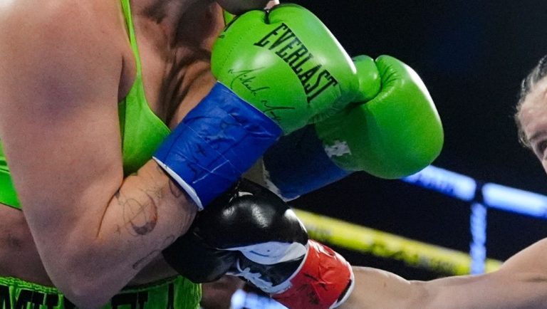 England's Sandy Ryan punches Mikaela Mayer of the U.S., during a women's WBO welterweight title boxing bout Saturday, Sept. 28.