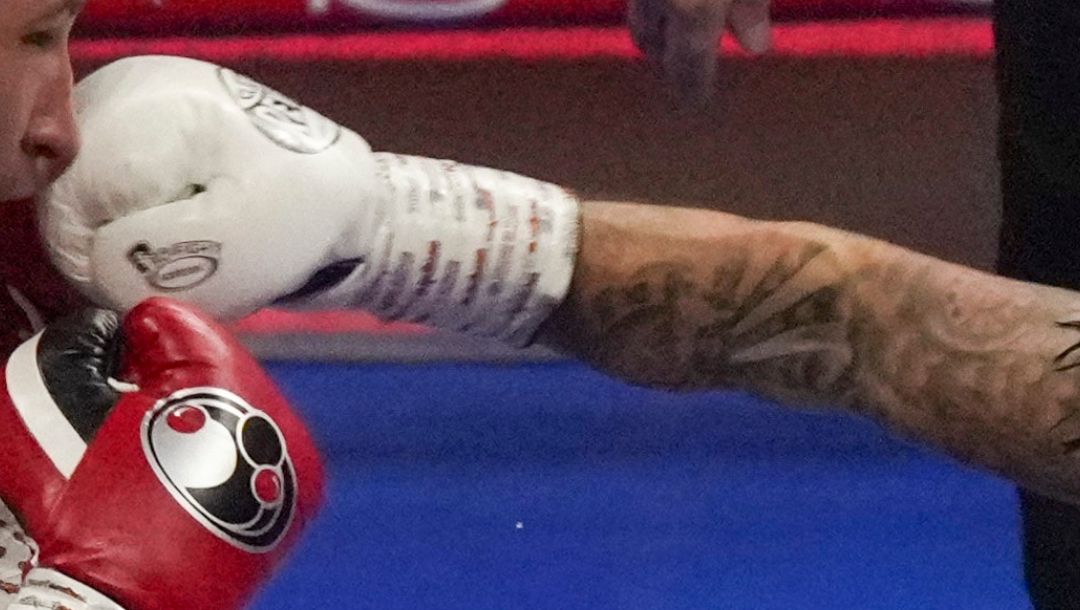 Boxers Isaac Lowe, left, and Lee McGregor compete during their WBC International Featherweight title fight in Riyadh.