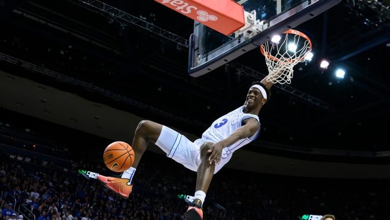 BYU forward AJ Dybantsa (3) dunks the ball during the first half of an NCAA college basketball game against Holy Cross, Saturday, Nov. 8, 2025, in Provo, Utah.