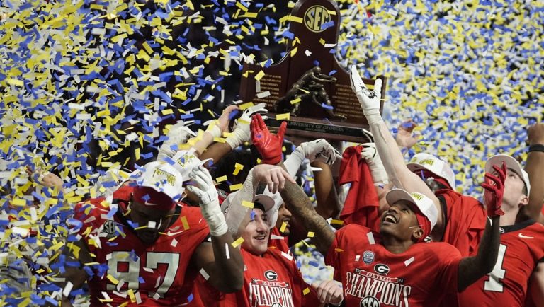 Georgia players celebrate victory over Texas after the Southeastern Conference championship NCAA college football game, Saturday, Dec. 7, 2024, in Atlanta.
