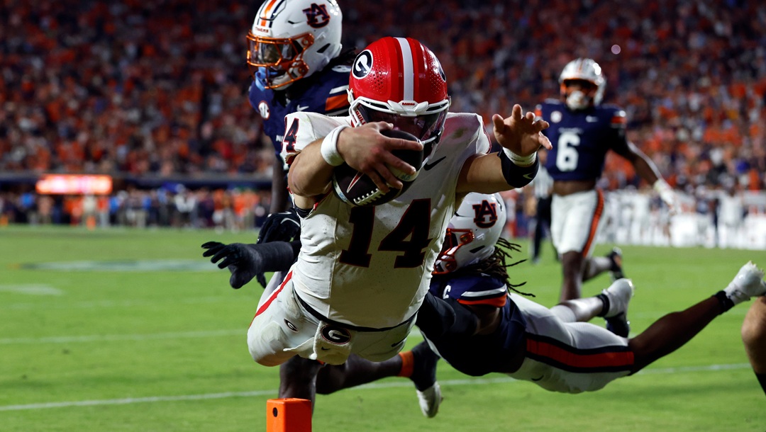 Georgia quarterback Gunner Stockton dives in for a touchdown during the second half of an NCAA college football game against Auburn, Saturday, Oct. 11, 2025, in Auburn, Ala.