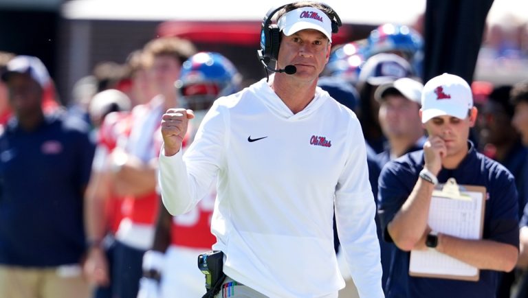 Mississippi head coach Lane Kiffin pumps his fist during the second half of an NCAA college football game against Washington State, Saturday, Oct. 11, 2025, in Oxford, Miss.