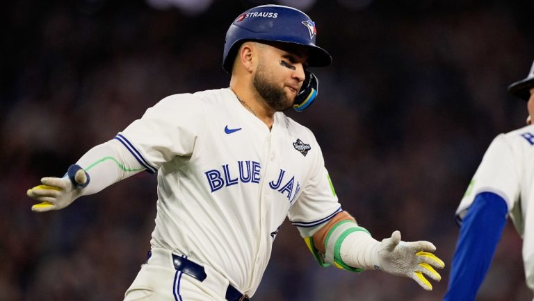 Toronto Blue Jays' Bo Bichette celebrates his three run home run against the Los Angeles Dodgers during the third inning in Game 7 of baseball's World Series, Saturday, Nov. 1, 2025, in Toronto.