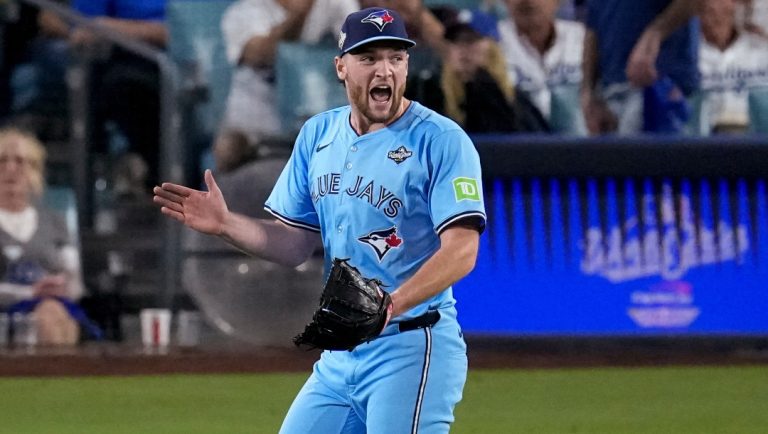 Toronto Blue Jays' pitcher Trey Yesavage celebrates as he walks to his dugout after striking out Los Angeles Dodgers' Freddie Freeman during the seventh inning in Game 5 of baseball's World Series, Wednesday, Oct. 29, 2025, in Los Angeles.