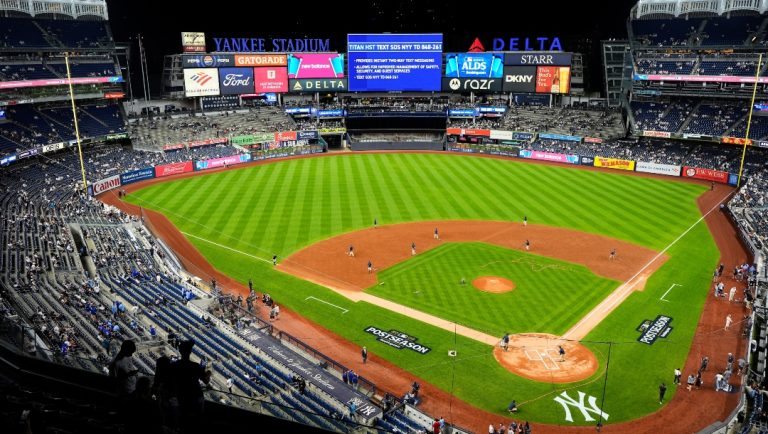 The grounds crew grooms the field before Game 3 of baseball's American League Division Series between the New York Yankees and the Toronto Blue Jays, Tuesday, Oct. 7, 2025, in New York.