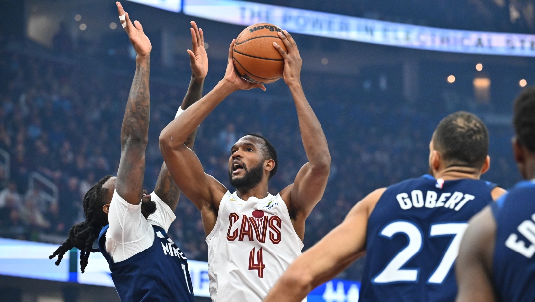 Evan Mobley #4 of the Cleveland Cavaliers shoots over Naz Reid #11 of the Minnesota Timberwolves during the first quarter at Rocket Mortgage Fieldhouse on February 10, 2025 in Cleveland, Ohio.