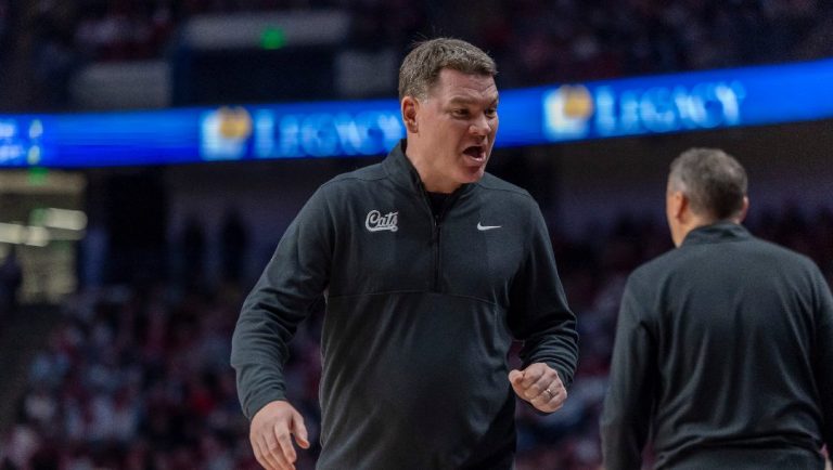 Arizona head coach Tommy Lloyd works with his team during the first half of an NCAA college basketball game against Alabama, Saturday, Dec. 13, 2025, in Birmingham, Ala.