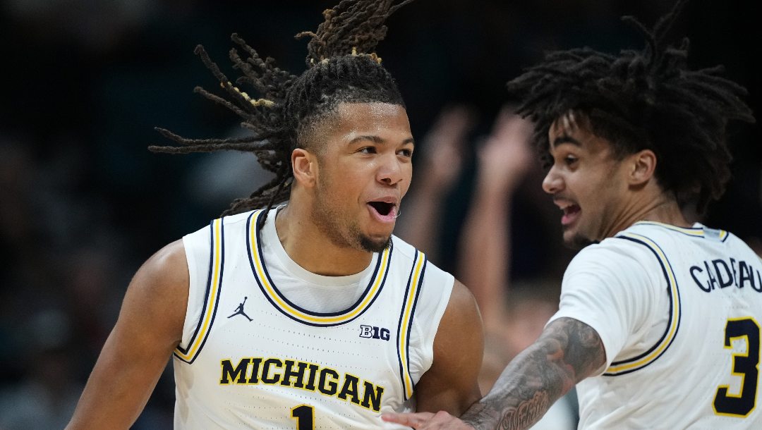 Michigan guard Trey McKenney (1) and guard Elliot Cadeau (3) celebrate a score against Gonzaga during the second half of an NCAA college basketball game in the Players Era tournament in Las Vegas, Wednesday, Nov. 26, 2025.