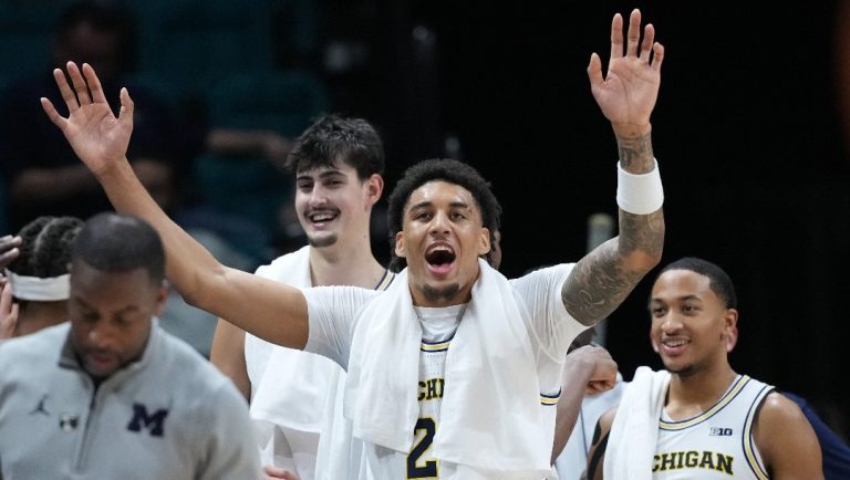 Michigan forward Yaxel Lendeborg (23) and teammates celebrate during the second half of an NCAA college basketball game against Gonzaga in the Players Era tournament in Las Vegas, Wednesday, Nov. 26, 2025.