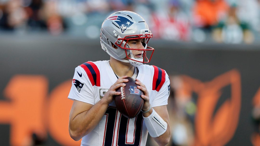 New England Patriots quarterback Drake Maye looks to pass during the second half of an NFL football game against the Cincinnati Bengals, Sunday, Nov. 23, 2025, in Cincinnati.