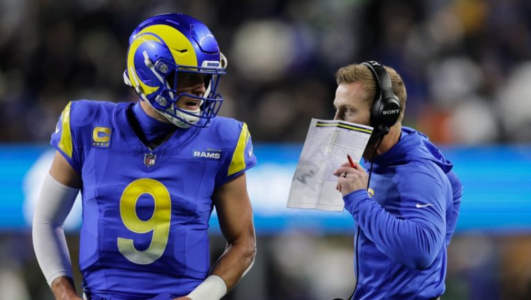 Los Angeles Rams head coach Sean McVay talks with quarterback Matthew Stafford (9) during the first half of an NFL football game Thursday, Dec. 18, 2025, in Seattle.