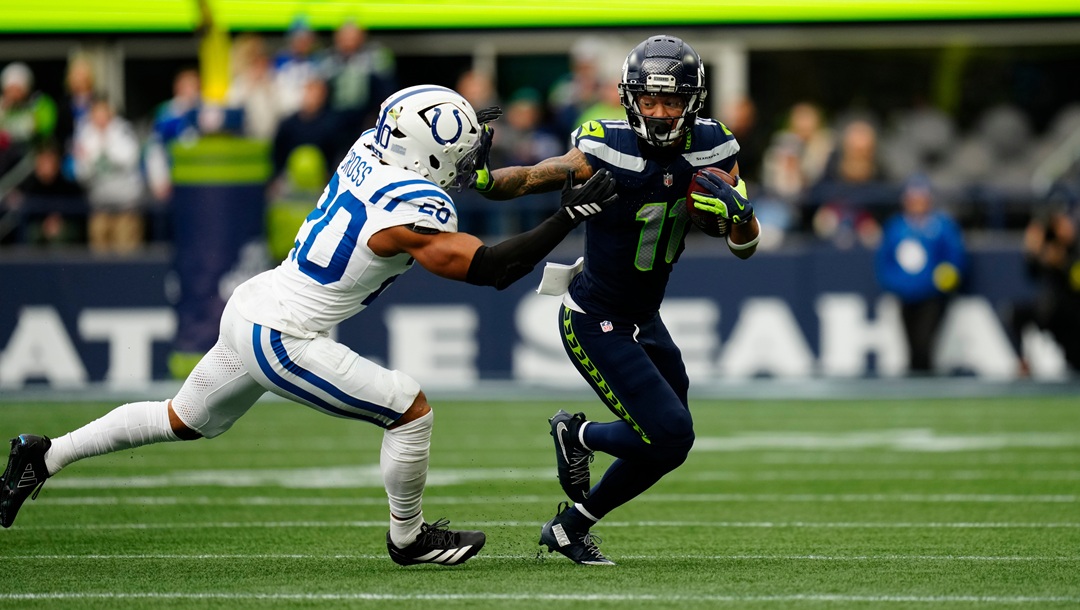 Seattle Seahawks wide receiver Jaxon Smith-Njigba (11) stiff arms Indianapolis Colts safety Nick Cross (20) during an NFL football game, Sunday, Dec. 14, 2025 in Seattle.