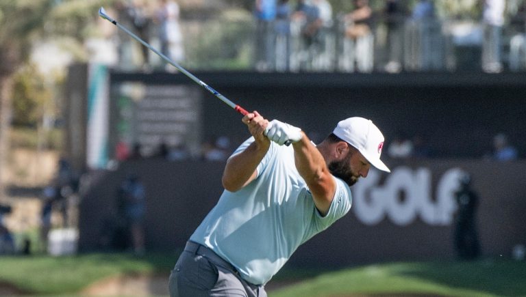 Captain Jon Rahm of Legion XIII GC hits his shot on the 18th hole during the final round of LIV Golf Jeddah at the Royal Greens Golf & Country Club on Sunday, March 03, 2024 in King Abdullah Economic City, Saudi Arabia. (Photo by Matthew Harris/LIV Golf via AP)