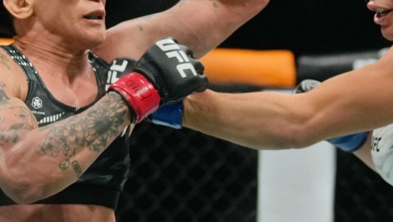 Brazil's Mackenzie Dern, right, fight Virna Jandiroba during a women's strawweight title bout at the mixed martial arts.