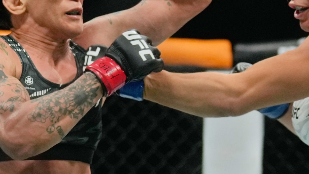 Brazil's Mackenzie Dern, right, fight Virna Jandiroba during a women's strawweight title bout at the mixed martial arts.