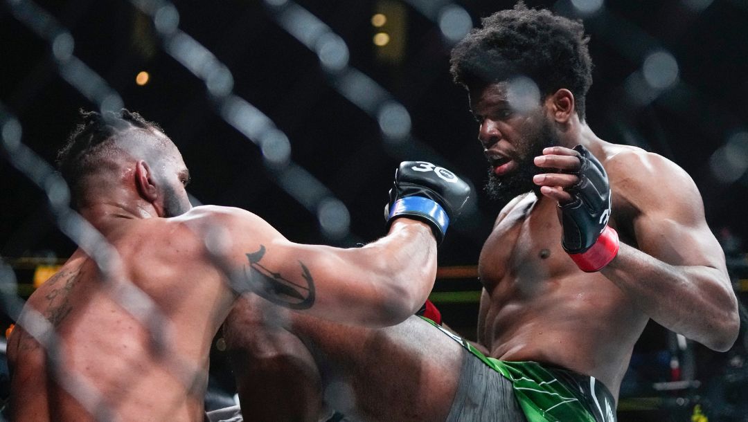 Nigeria's Kennedy Nzechukwu, right, knees Devin Clark during the second round of a light heavyweight bout at the UFC 288.