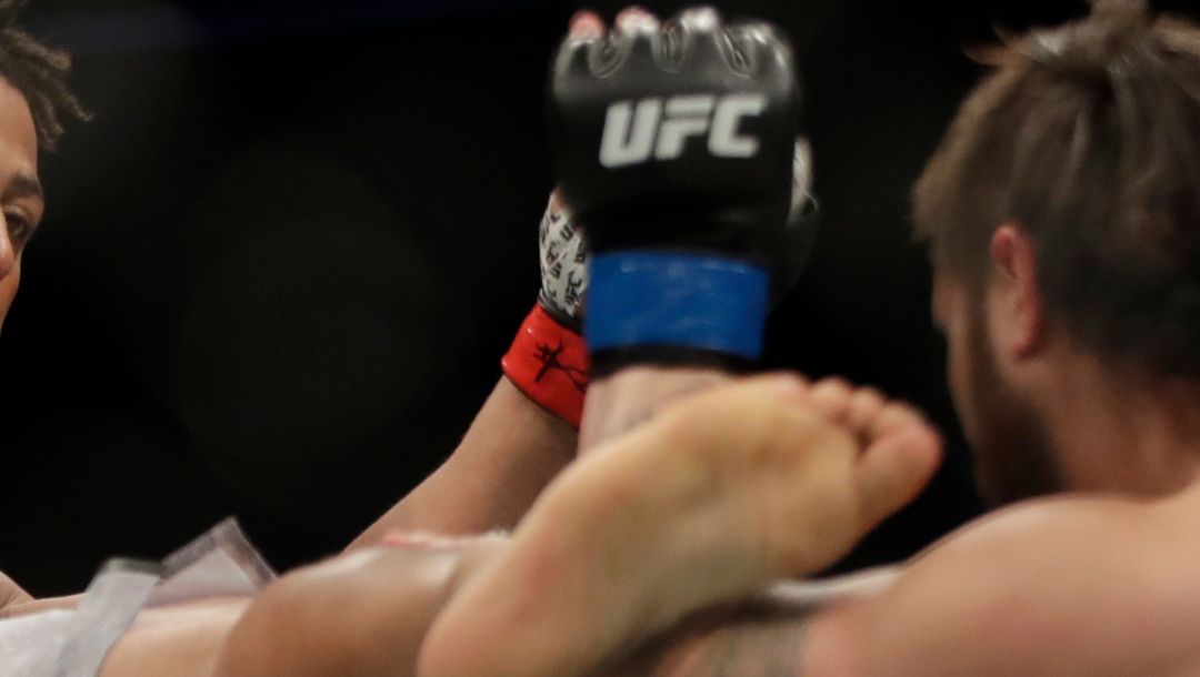 Greg Hardy kicks Ben Sosoli during a heavyweight mixed martial arts bout, Friday, Oct. 18, 2019, at UFC Fight Night in Boston.