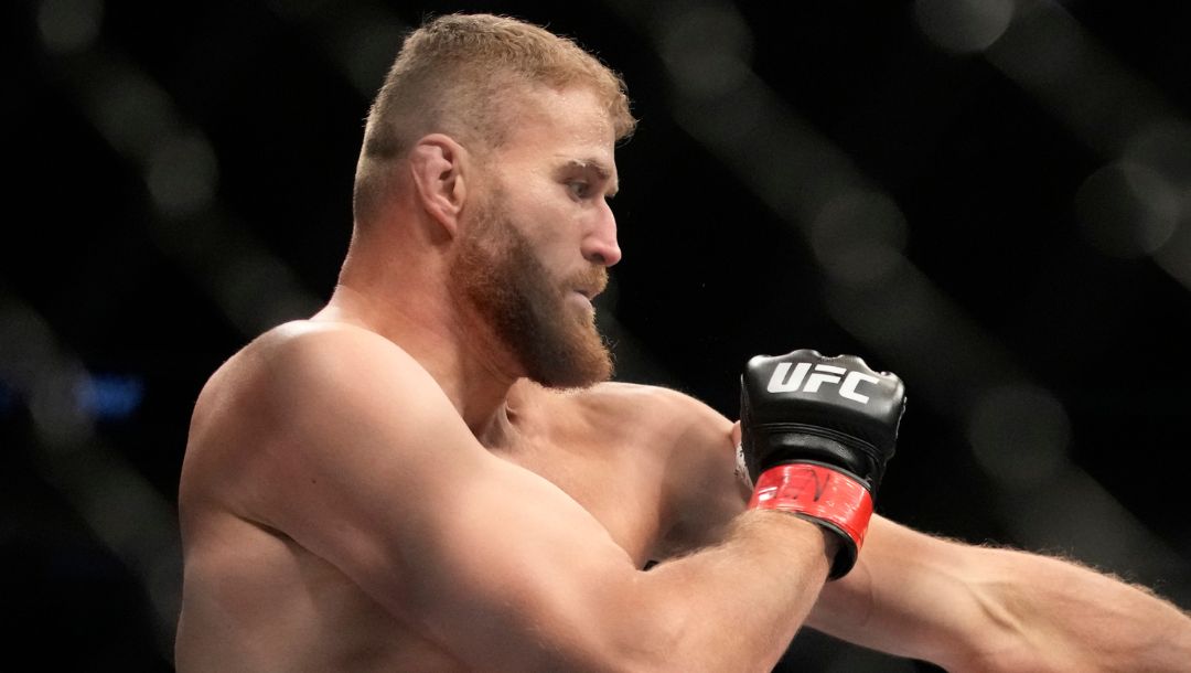 Magomed Ankalaev hits Jan Blachowicz during a UFC 282 mixed martial arts light heavyweight title bout Saturday, Dec. 10, 2022.