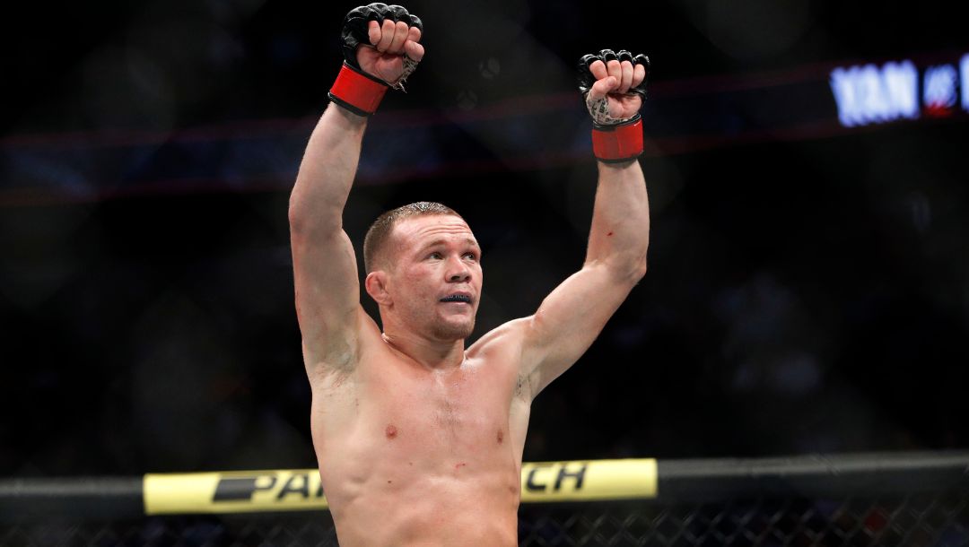 Petr Yan celebrates after defeating Urijah Faber in a mixed martial arts bantamweight bout at UFC 245, Saturday, Dec. 14, 2019.